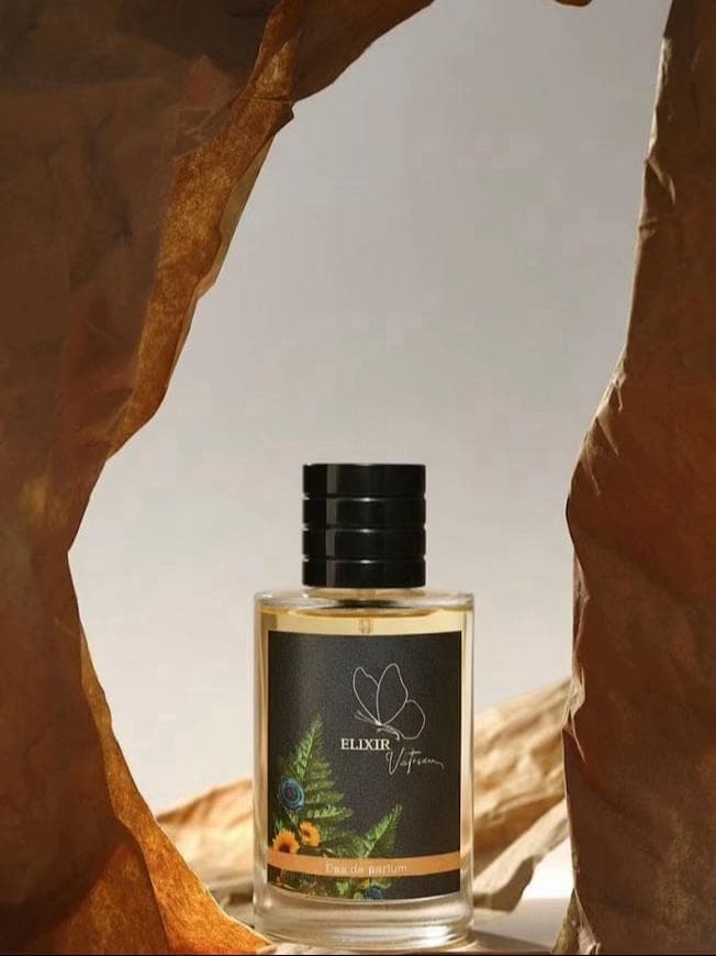Hands holding perfume